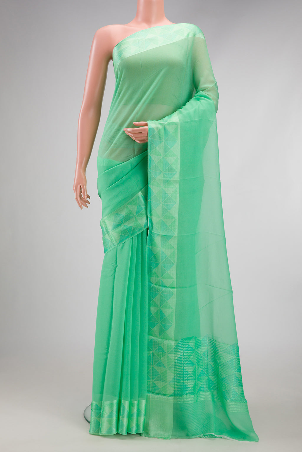 Sea Green Mysore Chiffon Saree with Plain Body and Thread Border.  displayed on a mannequin