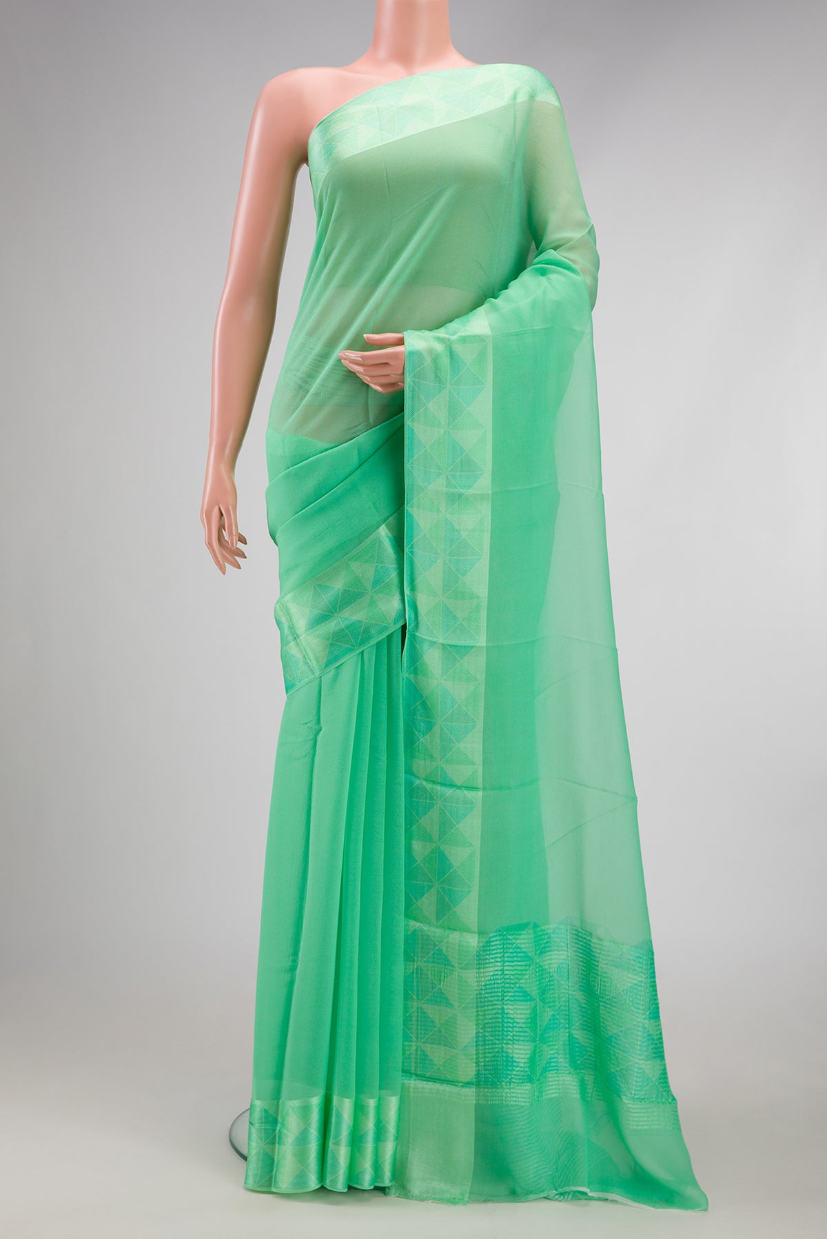 Sea Green Mysore Chiffon Saree with Plain Body and Thread Border.  displayed on a mannequin