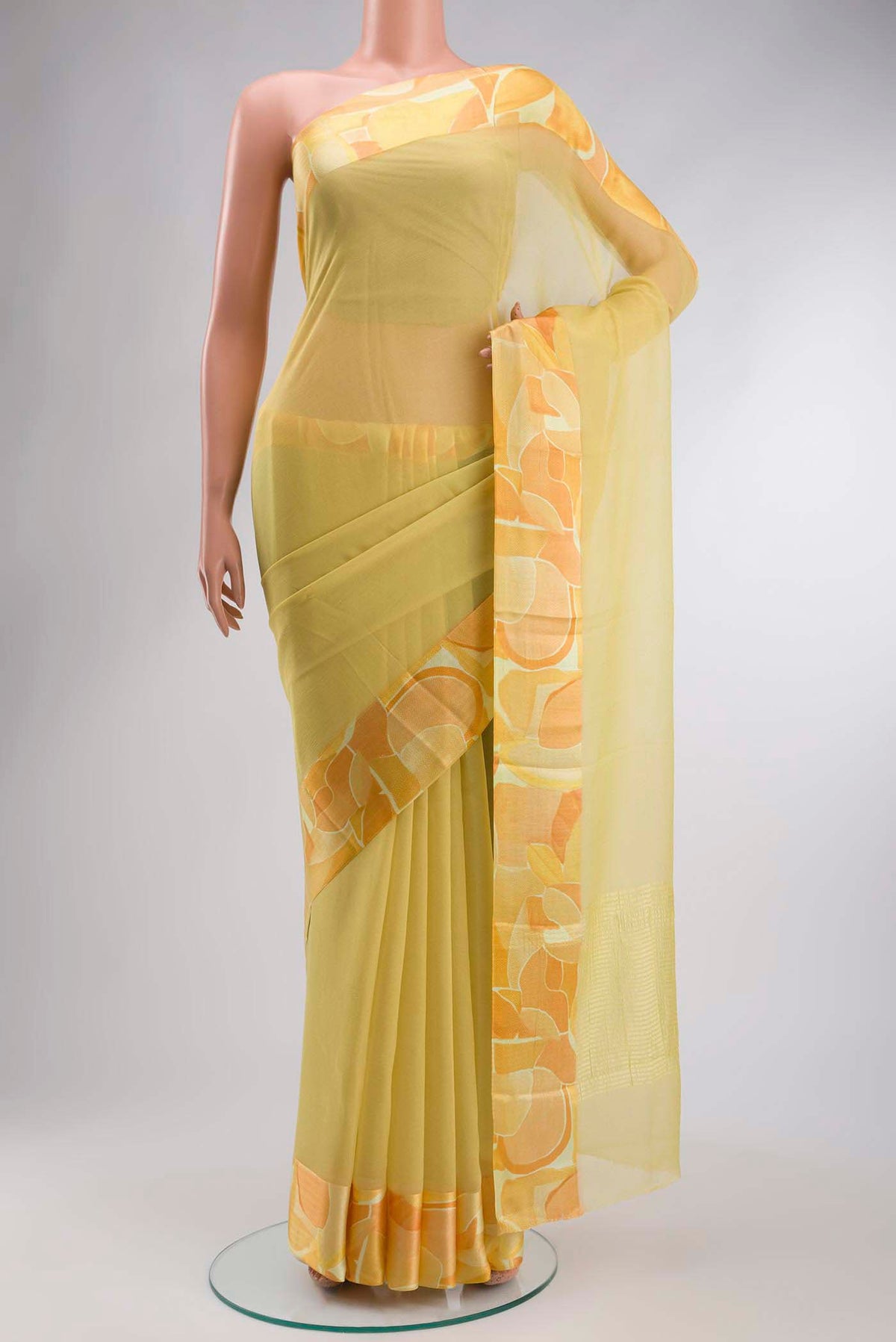 Yellow Mysore Chiffon Saree with Plain Body and Printed Border displayed on a mannequin