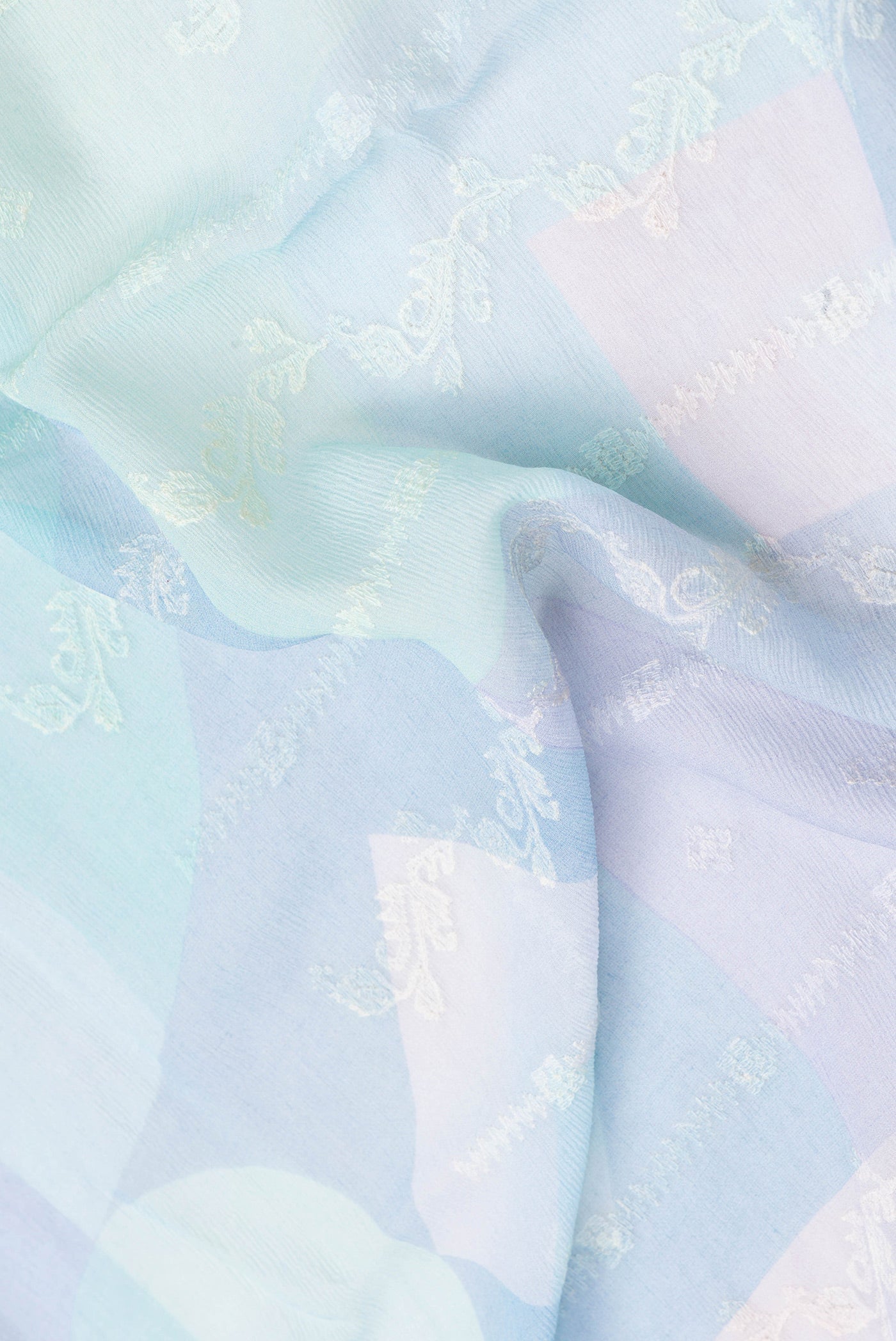 Close up of Multi Color Mysore Chiffon Saree with Embroidery on the body and Zari Border.  displaying folds