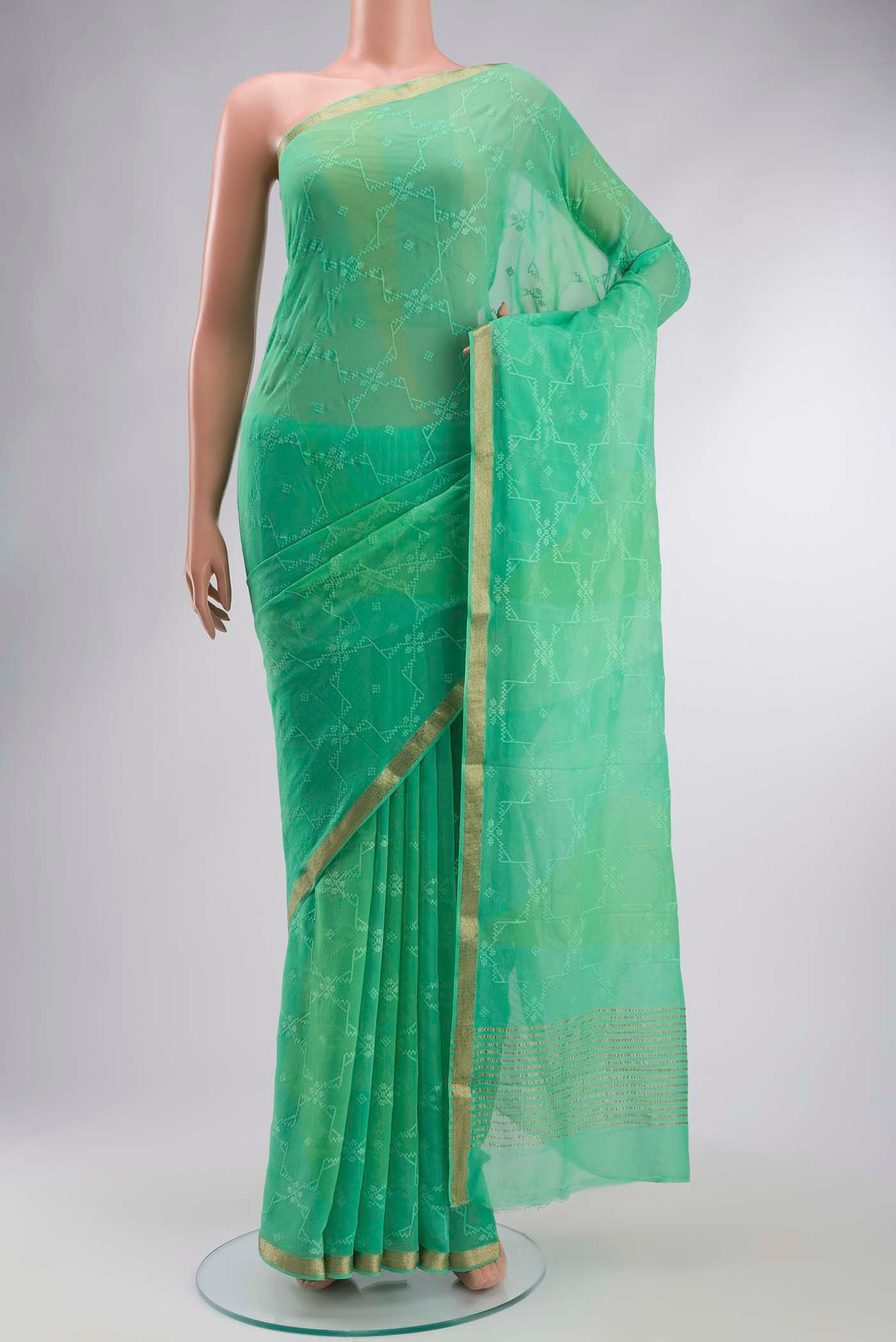 Green Mysore Chiffon Saree with Embroidery on the body and Zari Border displayed on a mannequin