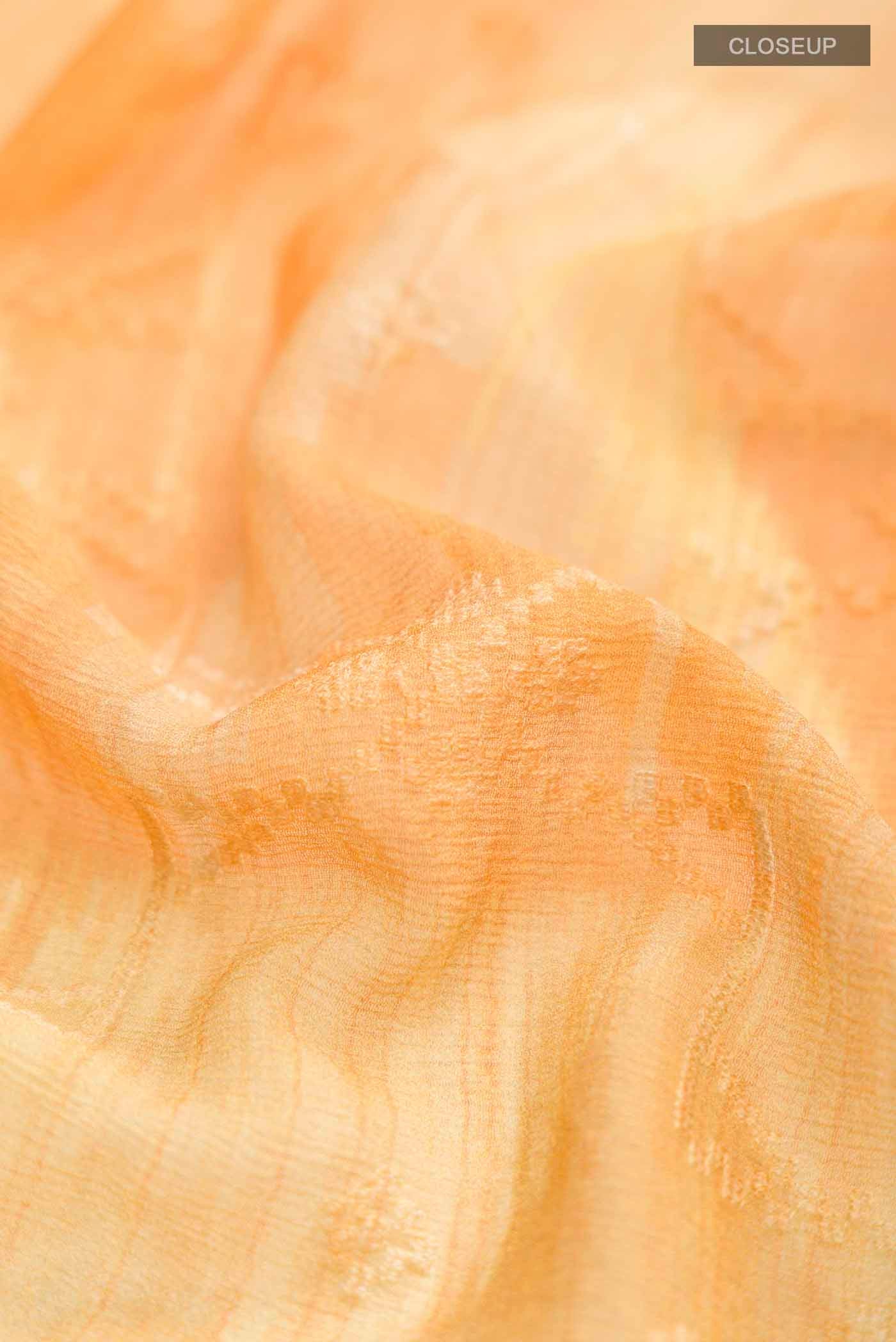 Close up of Yellow Mysore Chiffon Saree with Embroidery on the body and Zari Border displaying folds