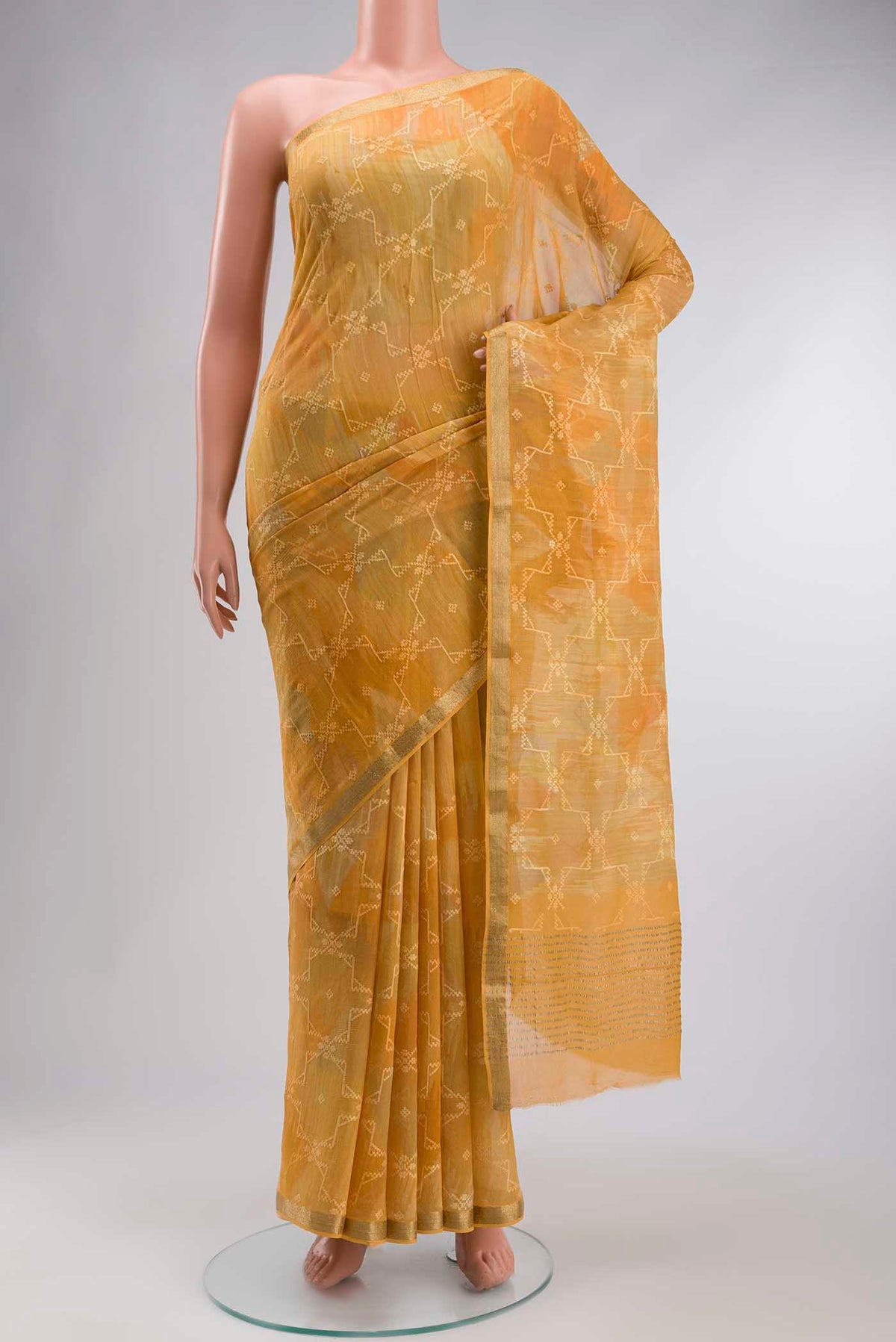 Yellow Mysore Chiffon Saree with Embroidery on the body and Zari Border displayed on a mannequin