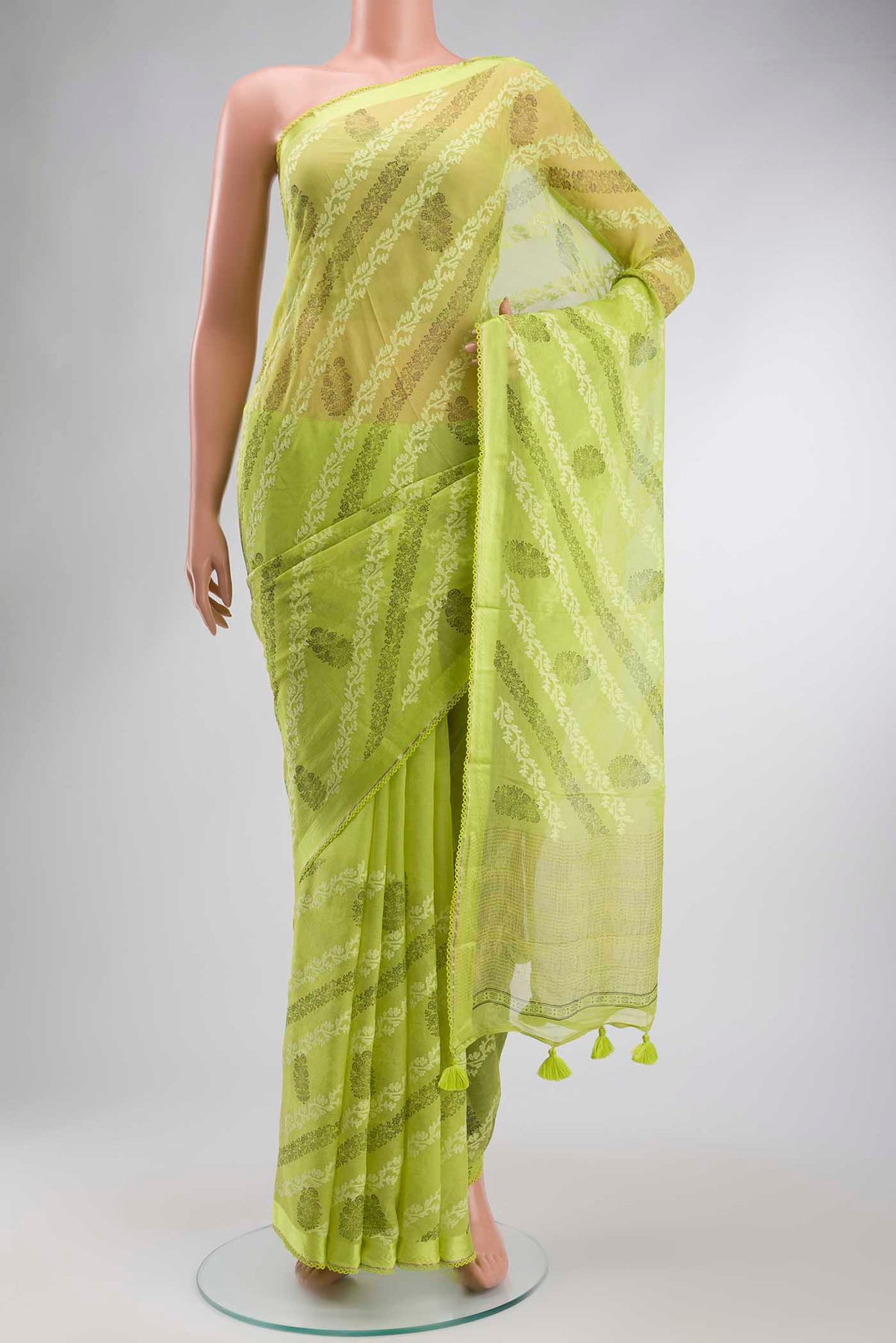 Green Mysore Chiffon Saree with Embroidery on the body and Zari Border displayed on a mannequin