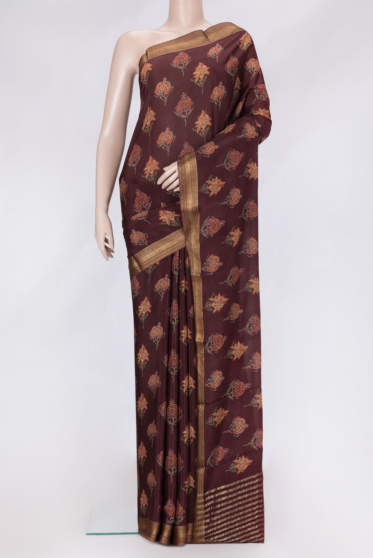 Maroon Dual Tone Crepe Saree with Printed design on the body and Zari Border.  displayed on a mannequin