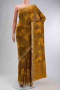 Mustard Mysore Crepe Saree with Printed design on the body and Zari Border displayed on a mannequin