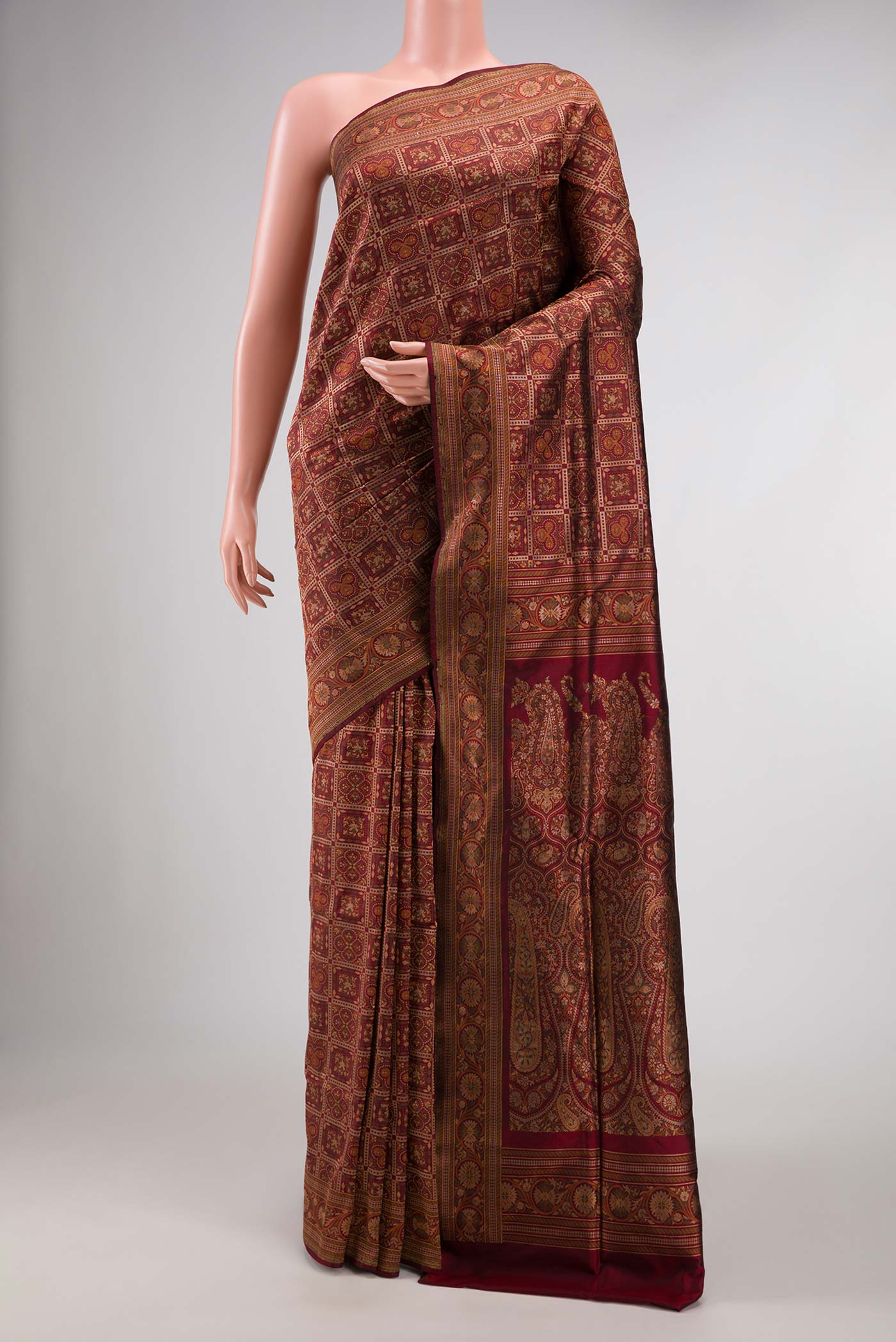 Maroon Dual Tone Banarasi Silk Saree with Zari Brocade on the body and Zari Border displayed on a mannequin