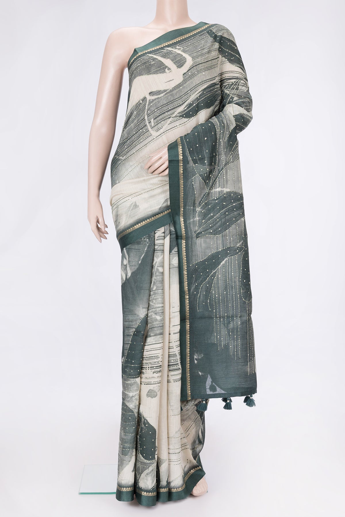 Beige Dual Tone Tussar Silk Saree with Embroidery on the body and Zari Border.  displayed on a mannequin
