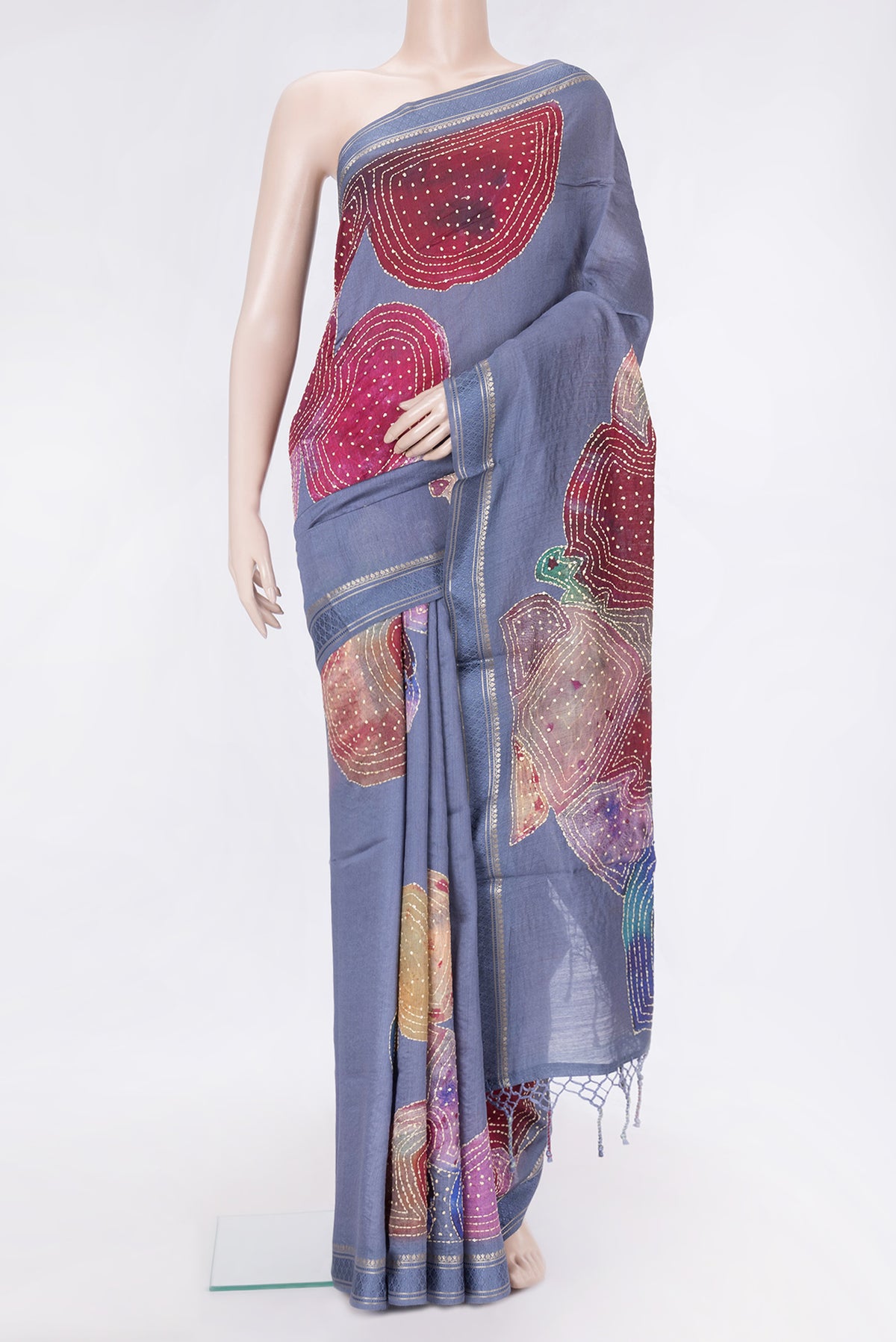 Grey Dual Tone Tussar Silk Saree with Embroidery on the body and Zari And Thread Border.  displayed on a mannequin