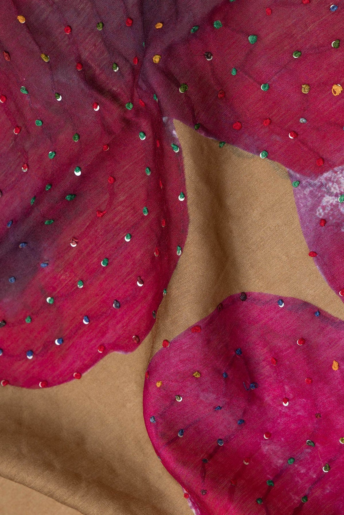 Close up of Brown Dual Tone Tussar Silk Saree with Embroidery on the body and Zari And Thread Border.  displaying folds