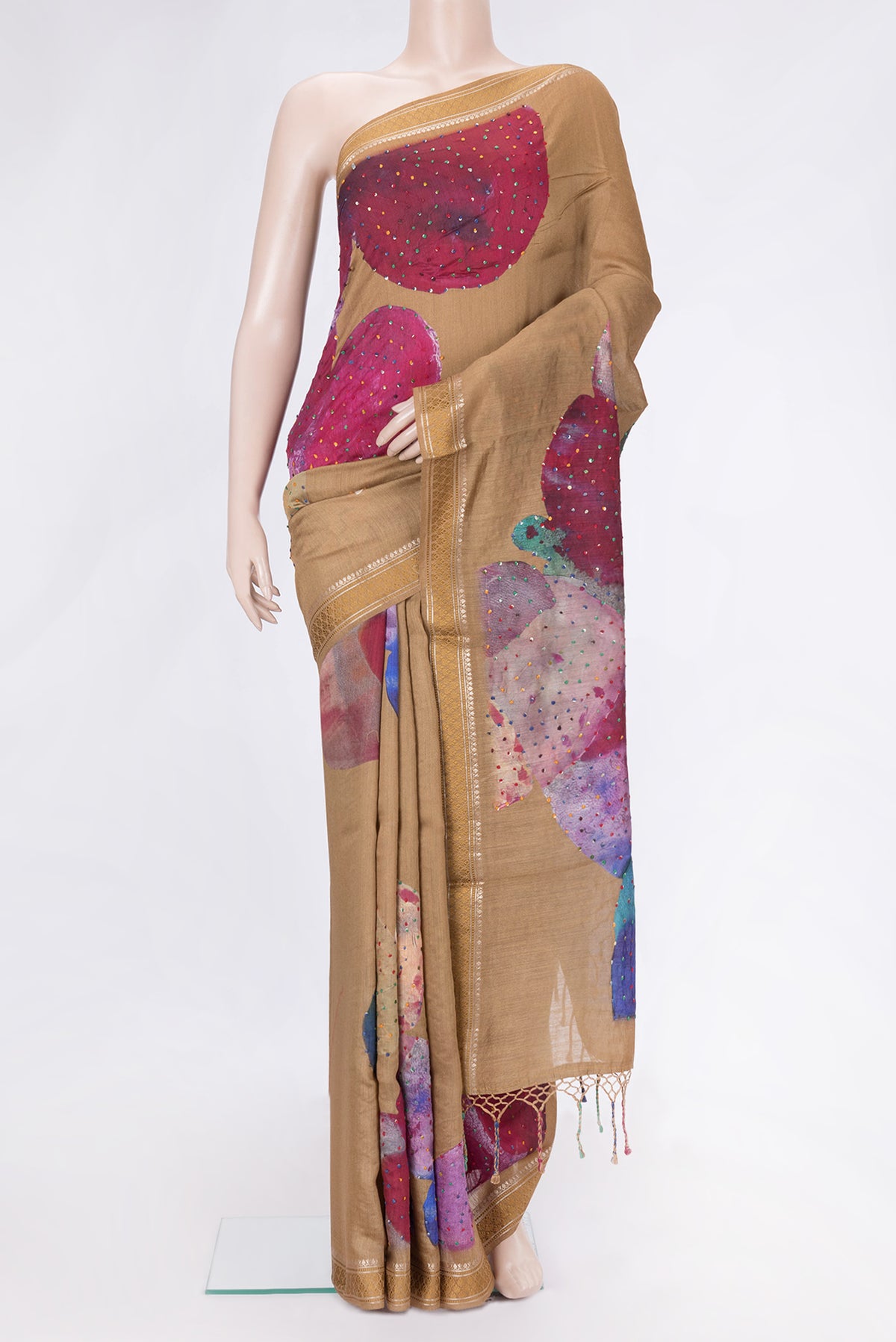Brown Dual Tone Tussar Silk Saree with Embroidery on the body and Zari And Thread Border.  displayed on a mannequin