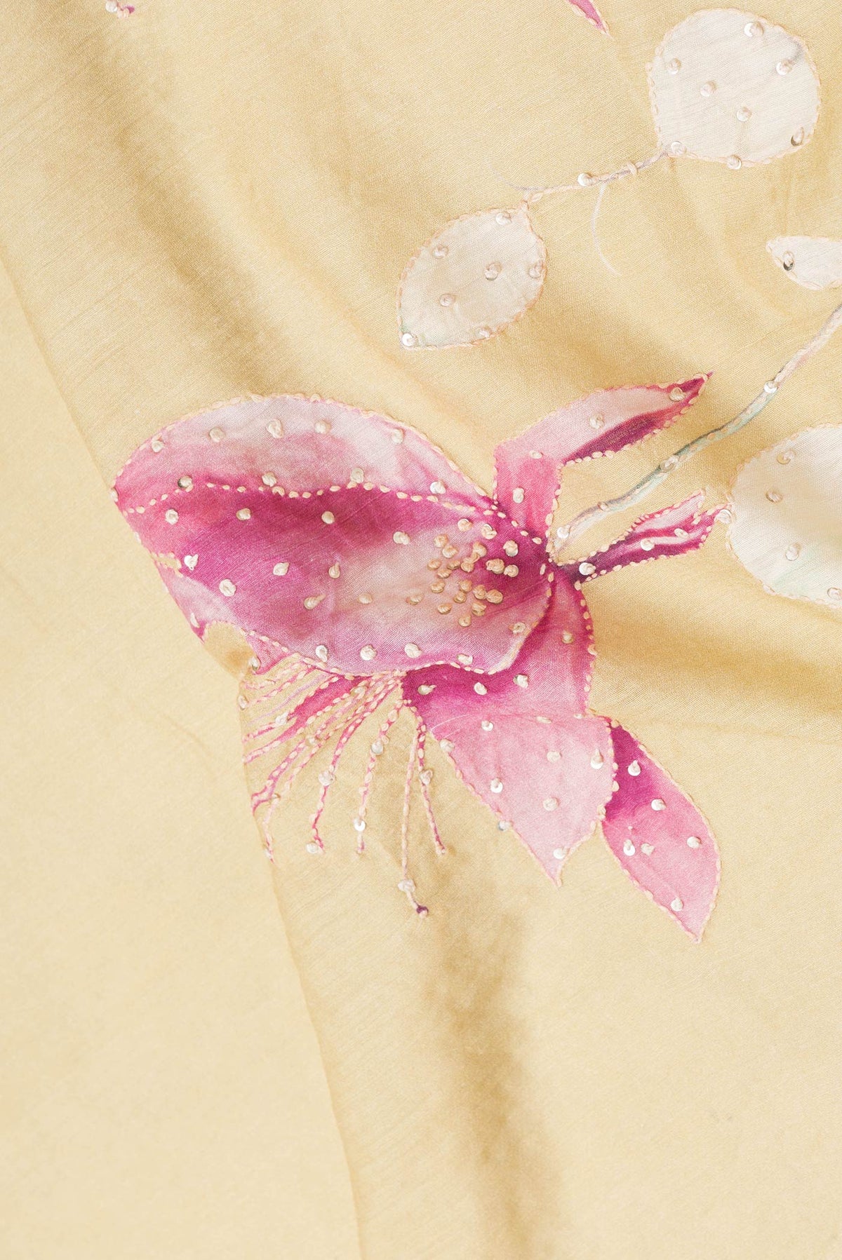 Close up of Sandal Dual Tone Tussar Silk Saree with Embroidery on the body and Zari And Thread Border.  displaying folds