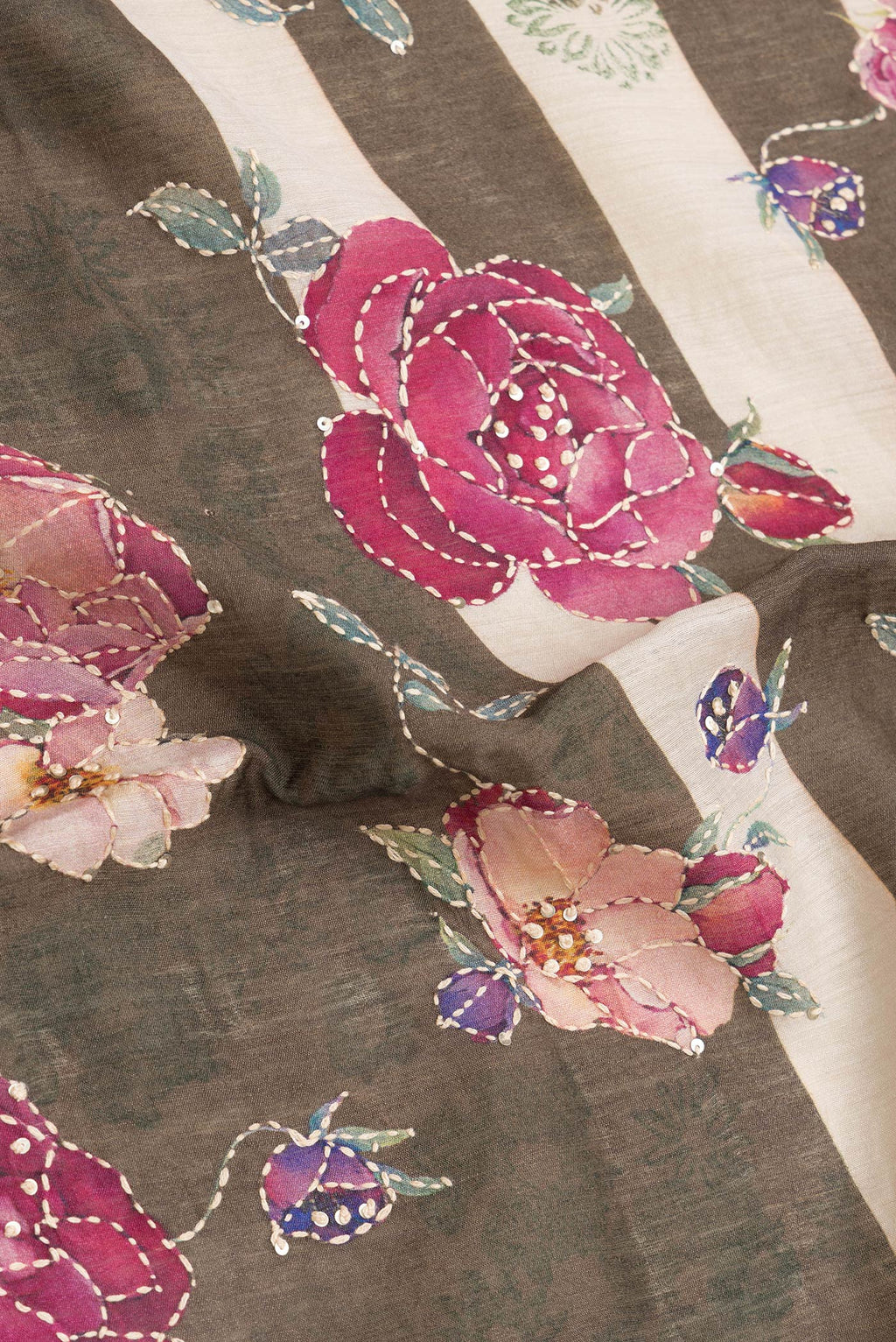 Close up of Mehandi Green Dual Tone Tussar Silk Saree with Embroidery on the body and Zari And Thread Border.  displaying folds