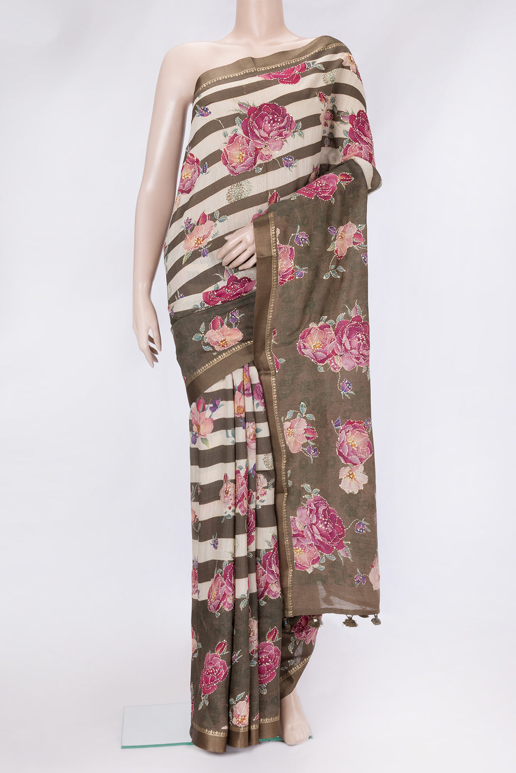 Mehandi Green Dual Tone Tussar Silk Saree with Embroidery on the body and Zari And Thread Border.  displayed on a mannequin