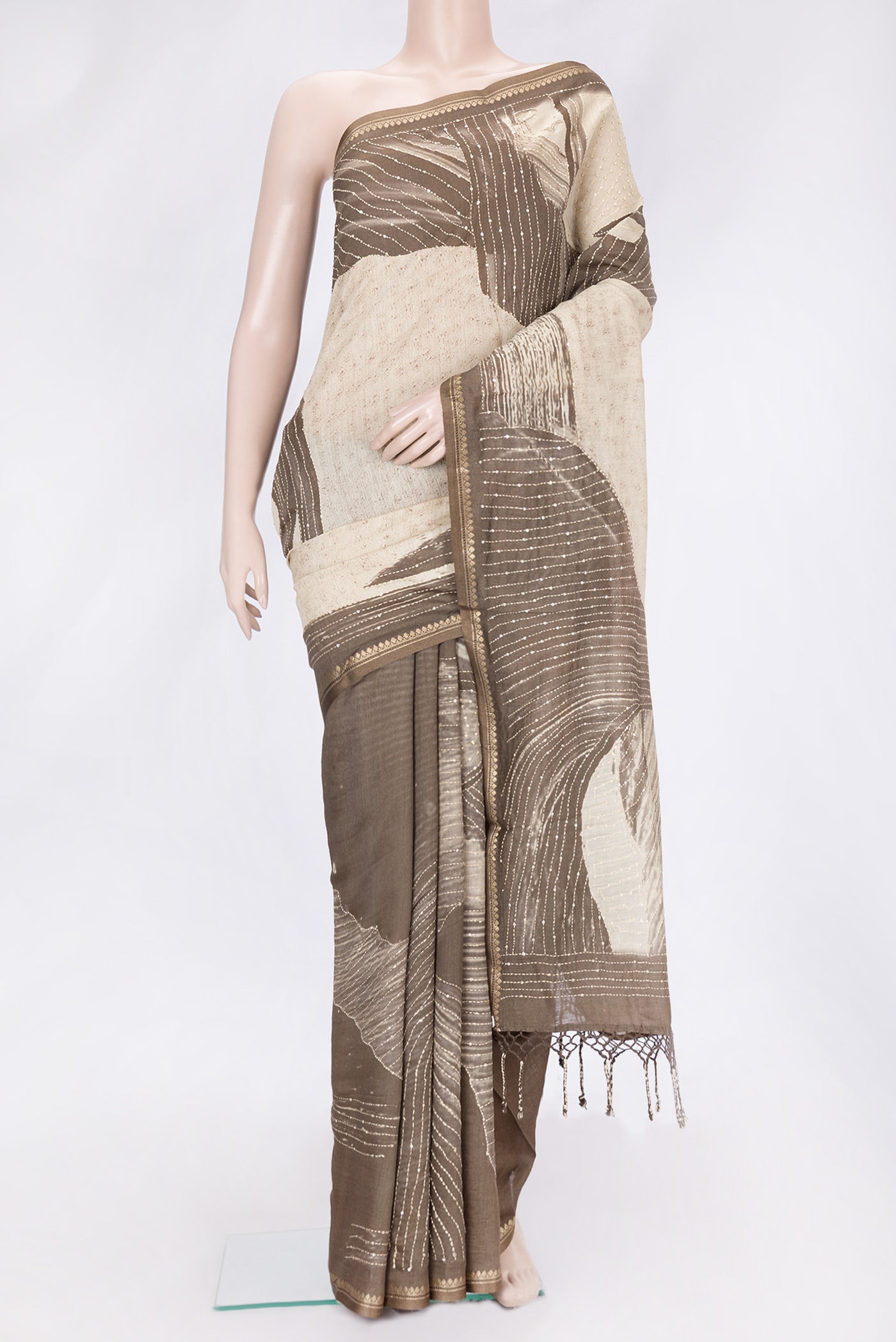 Beige Dual Tone Tussar Silk Saree with Embroidery on the body and Embroidery Border.  displayed on a mannequin