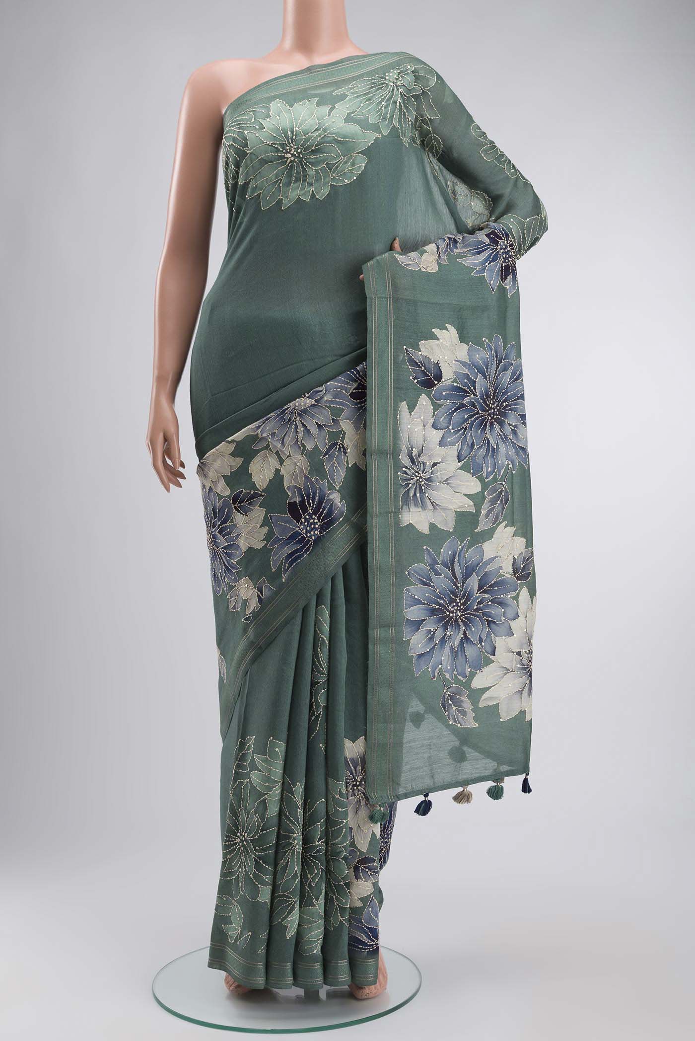 Sage Green Tussar Silk Saree with Embroidery on the body and Thread Border displayed on a mannequin