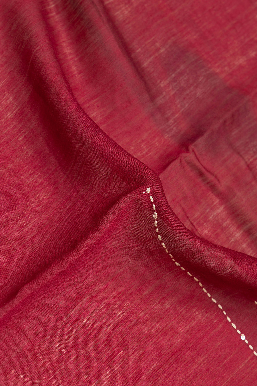 Close up of Beige Dual Tone Tussar Silk Saree with Embroidery on the body and Embroidery Border.  displaying folds