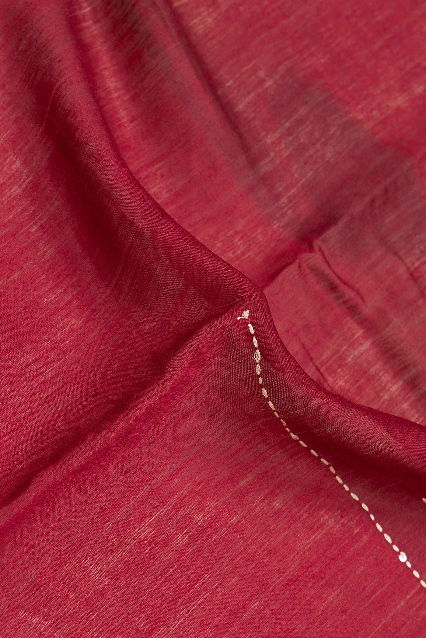 Close up of Beige Dual Tone Tussar Silk Saree with Embroidery on the body and Embroidery Border.  displaying folds