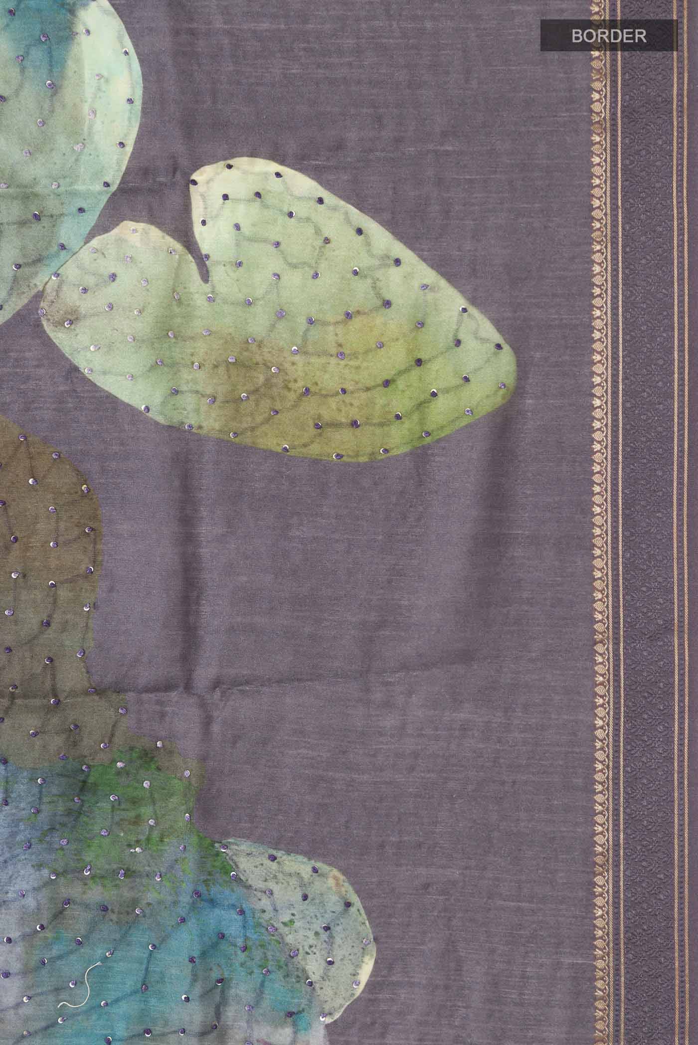 Border image of Grey Tussar Silk Saree with Embroidery on the body and Zari And Thread Border