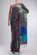 Grey Tussar Silk Saree with Embroidery on the body and Zari And Thread Border displayed on a mannequin
