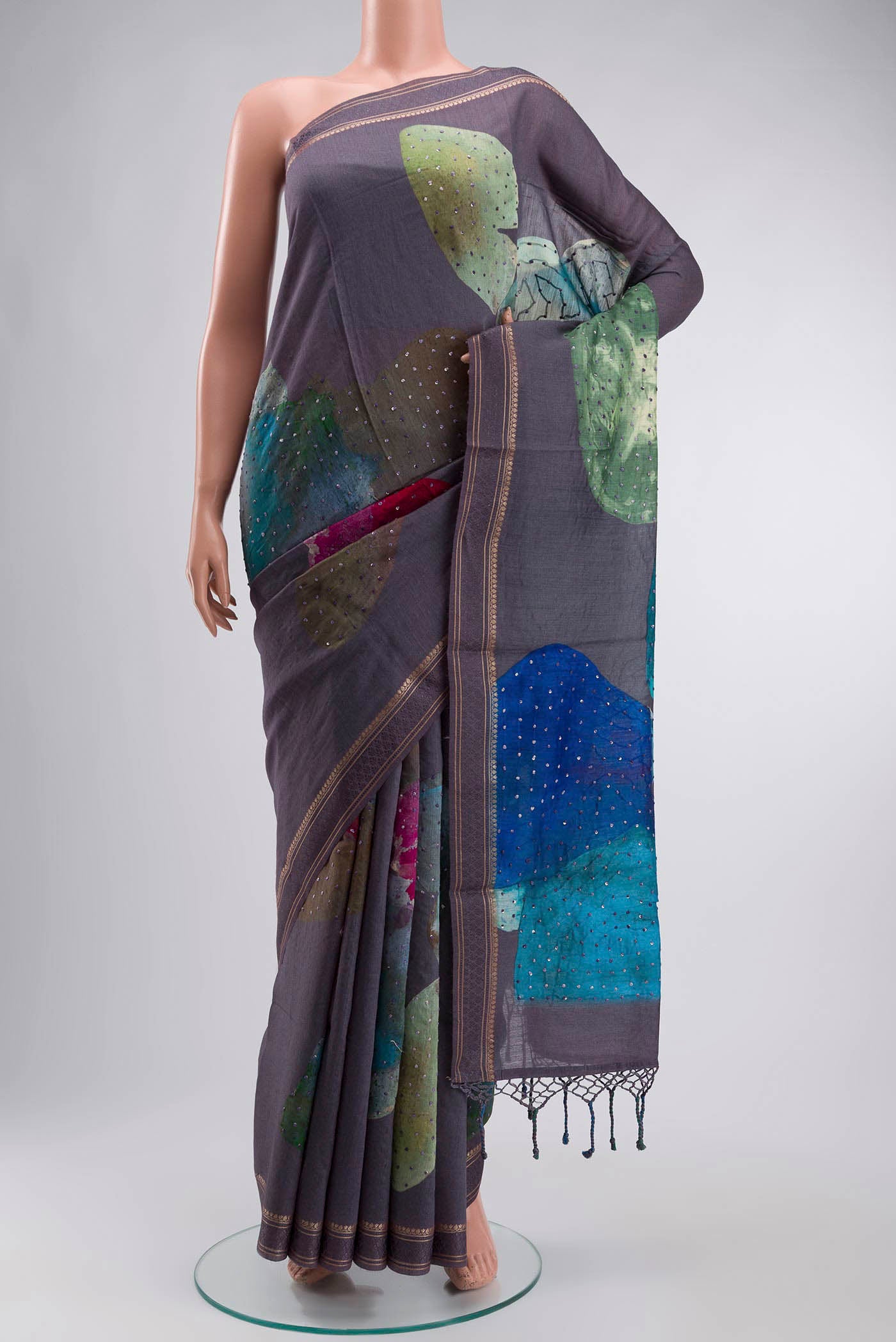 Grey Tussar Silk Saree with Embroidery on the body and Zari And Thread Border displayed on a mannequin