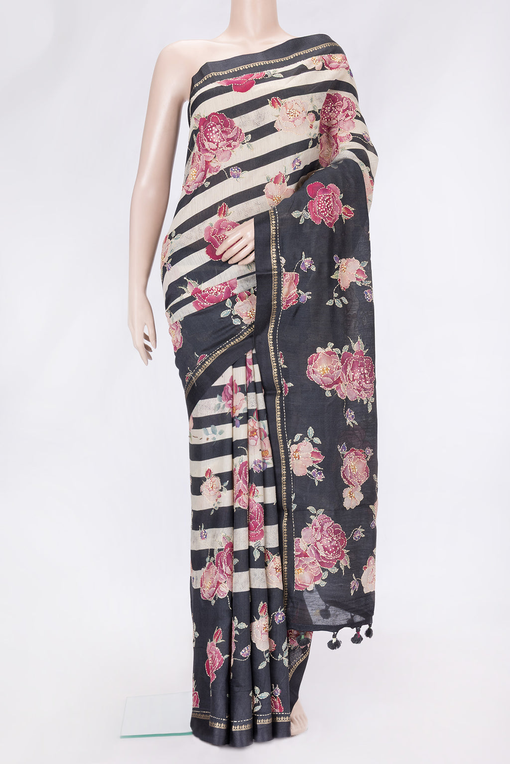 Black Dual Tone Tussar Silk Saree with Embroidery on the body and Zari And Thread Border.  displayed on a mannequin