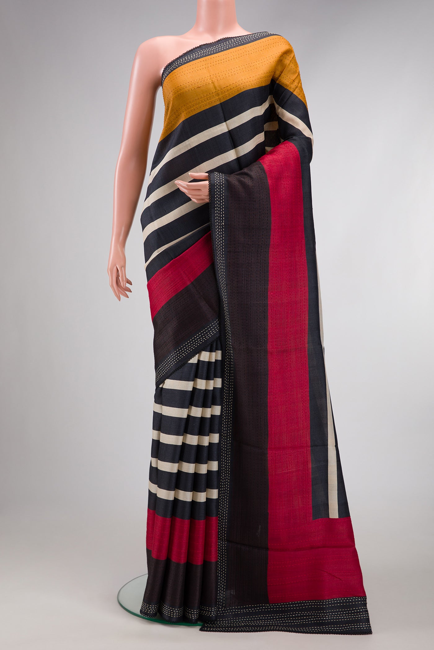 Black Dual Tone Tussar Silk Saree with Stripes on the body and Plain Border.  displayed on a mannequin