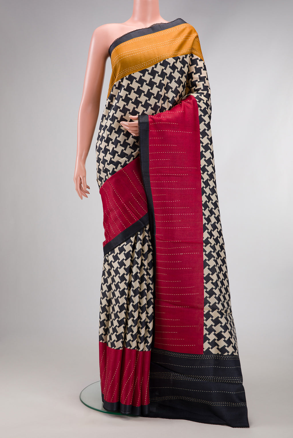 Black Dual Tone Tussar Silk Saree with Printed design on the body and Embroidery Border.  displayed on a mannequin