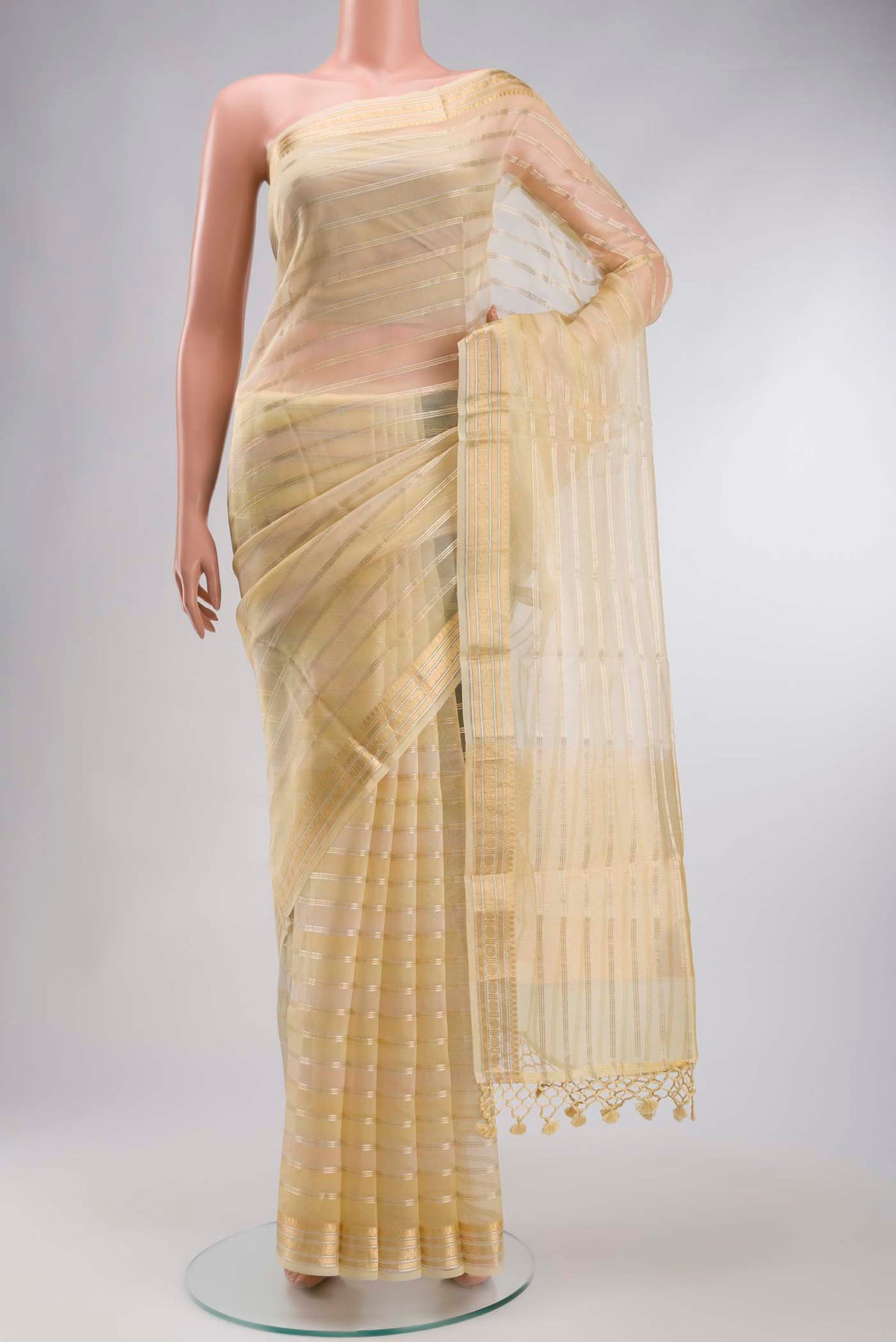 Sandal Organza Silk Saree with Stripes on the body and Zari Border displayed on a mannequin