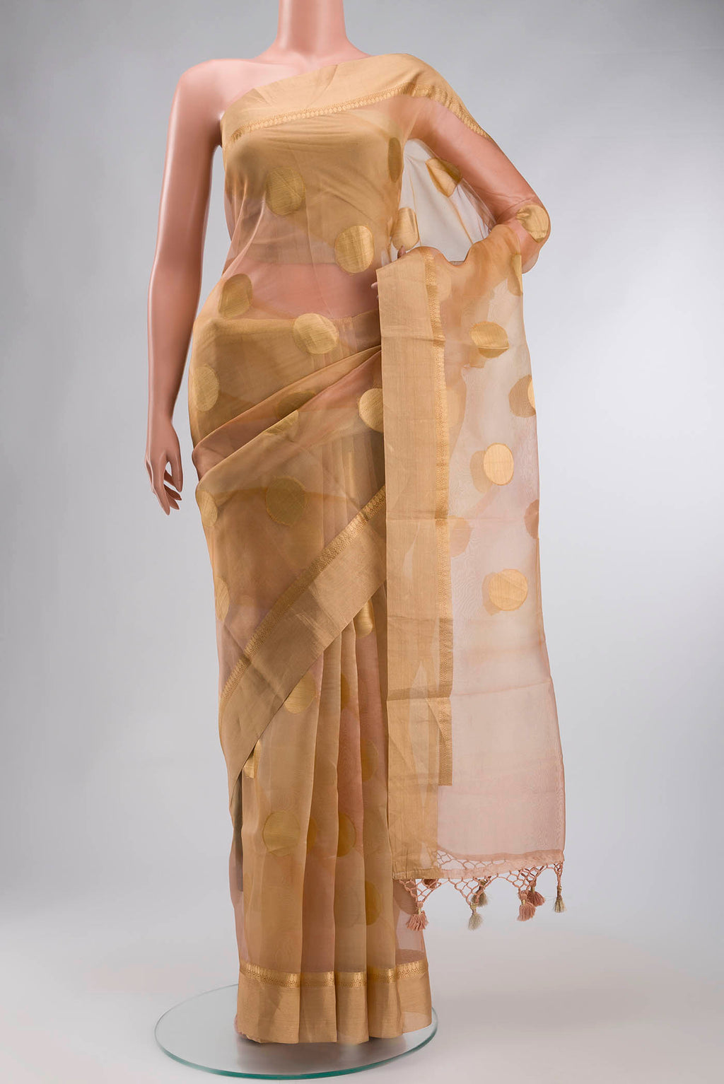 Sandal Organza Silk Saree with Zari Butta on the body and Zari Border displayed on a mannequin
