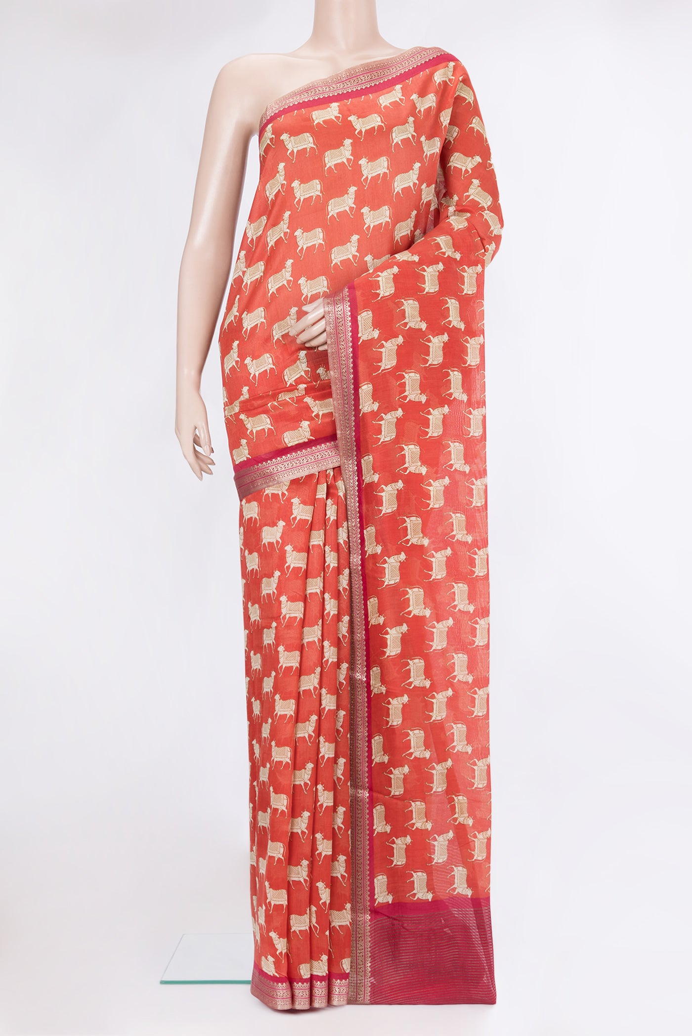 Orange Dual Tone Chanderi Silk Saree with Printed design on the body and Zari Border.  displayed on a mannequin