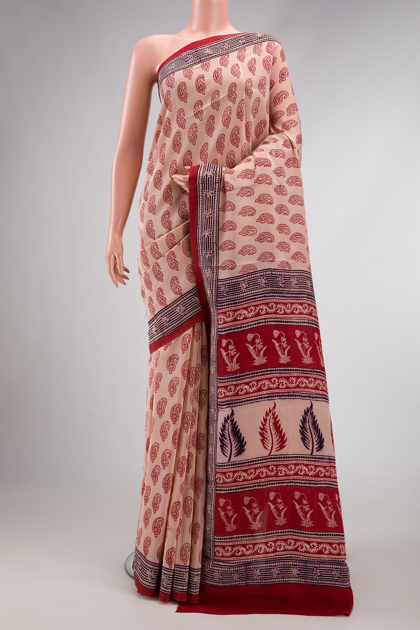 Rose Gold Dual Tone Mysore Crepe Saree with Printed design on the body and Printed Border.  displayed on a mannequin
