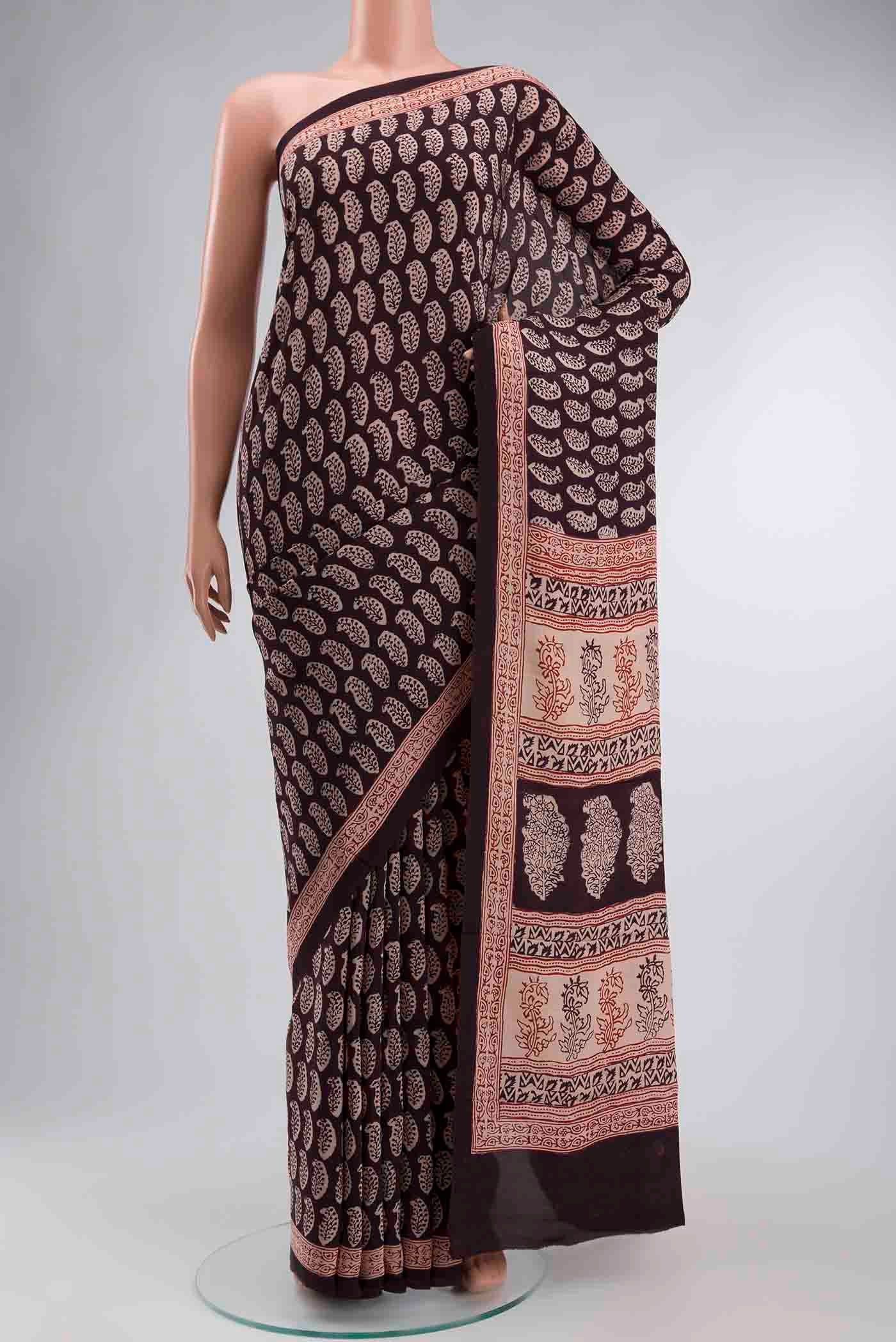 Black Mysore Crepe Saree with Printed design on the body and Printed Border displayed on a mannequin