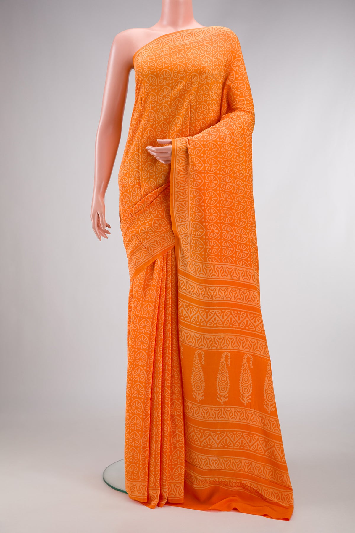 Orange Dual Tone Mysore Crepe Saree with Printed design on the body and Printed Border.  displayed on a mannequin