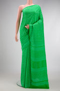 Parrot Green Dual Tone Mysore Crepe Saree with Printed design on the body and Printed Border.  displayed on a mannequin