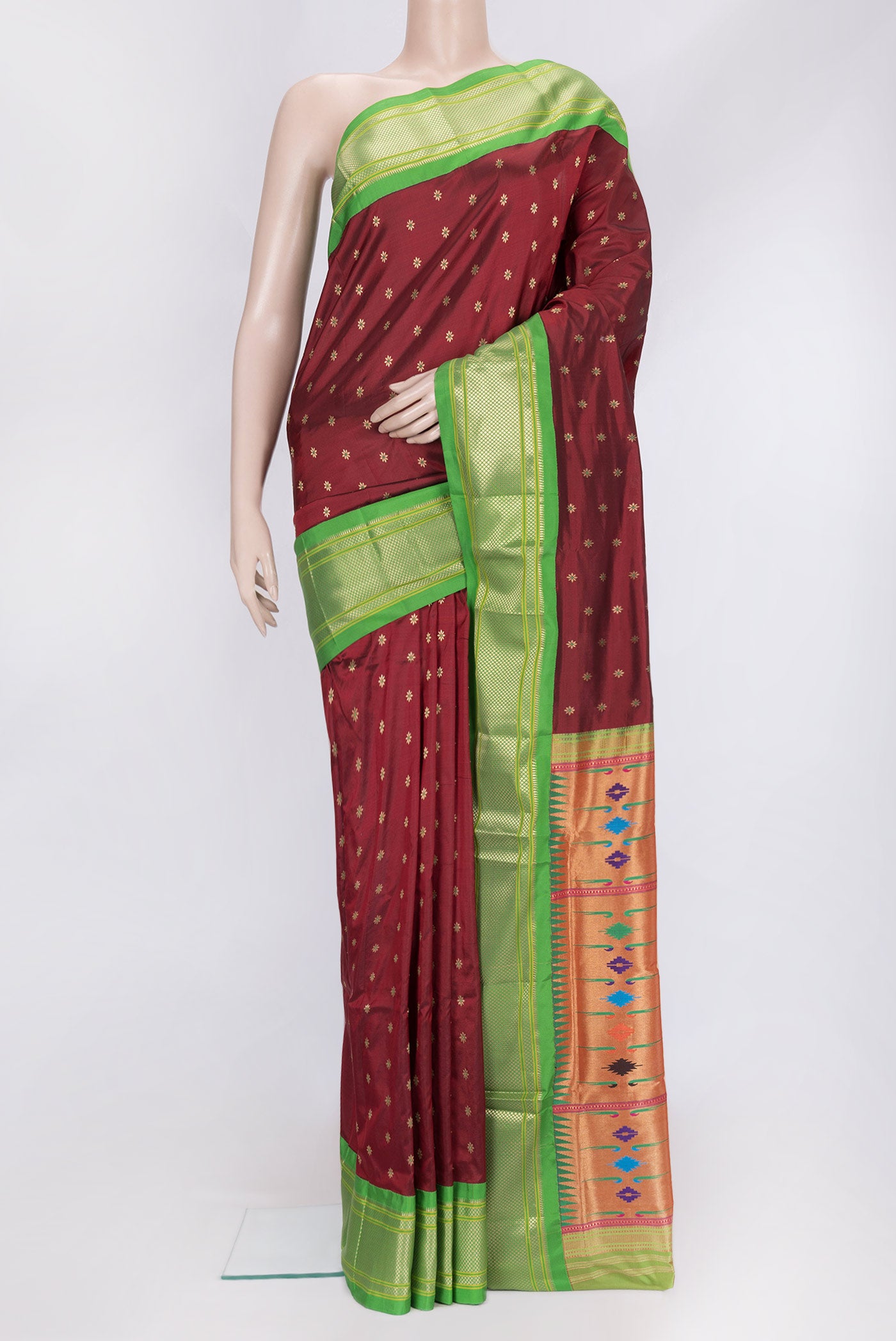 Maroon Dual Tone Paithani Silk Saree with Zari And Thread Butta on the body and Zari Border.  displayed on a mannequin