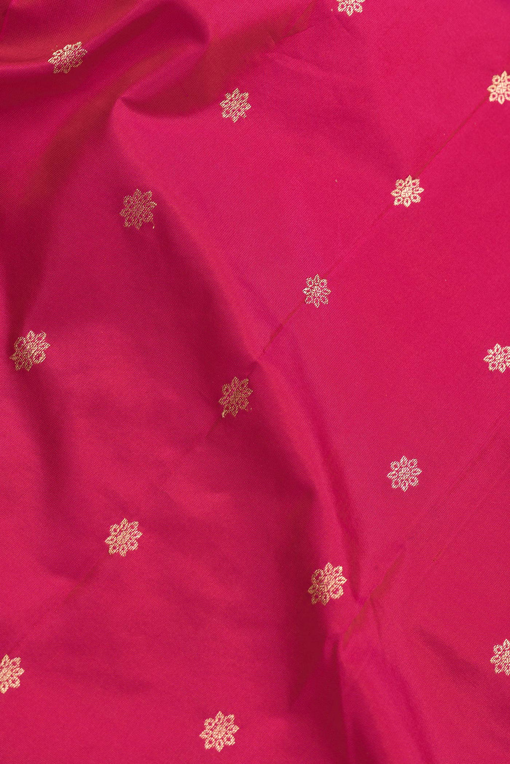 Close up of Pink Dual Tone Paithani Silk Saree with Zari Butta on the body and Zari Border.  displaying folds