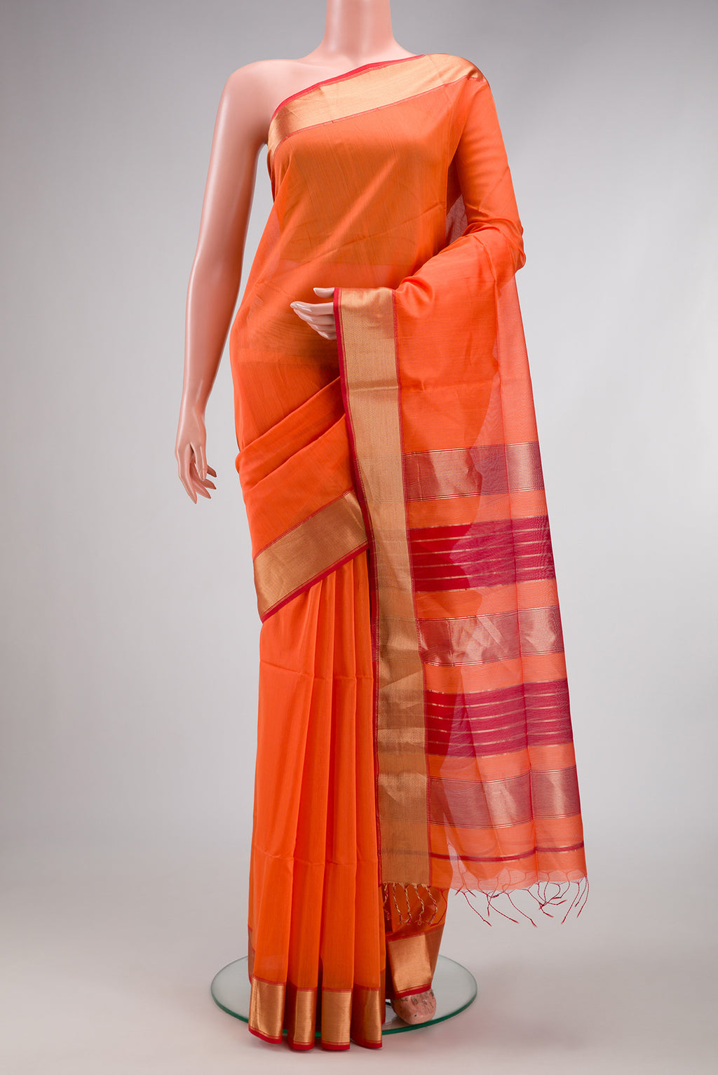 Orange Dual Tone Maheshwari Silk Cotton Saree with Plain Body and Zari Border.  displayed on a mannequin