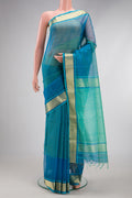 Peacock Blue Dual Tone Maheshwari Silk Cotton Saree with Checked design on the body and Zari Border.  displayed on a mannequin
