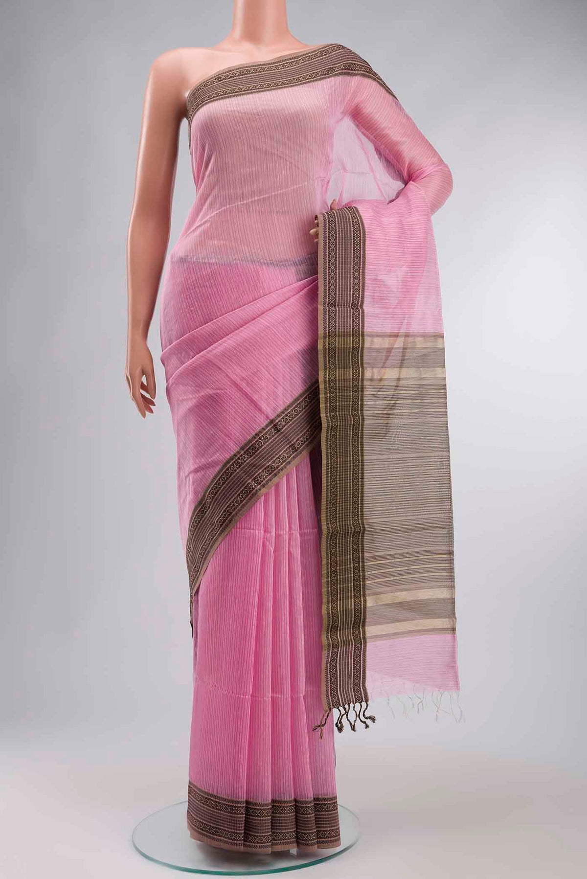 Pink Maheshwari Silk Cotton Saree with Stripes on the body and Zari And Thread Border displayed on a mannequin