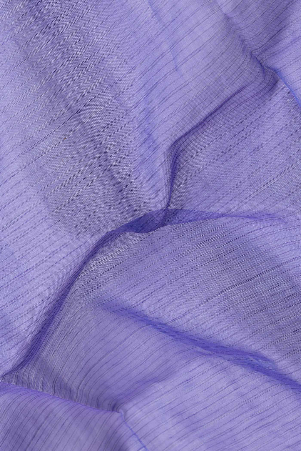 Close up of Lavender Dual Tone Maheshwari Silk Saree with Stripes on the body and Zari Border.  displaying folds
