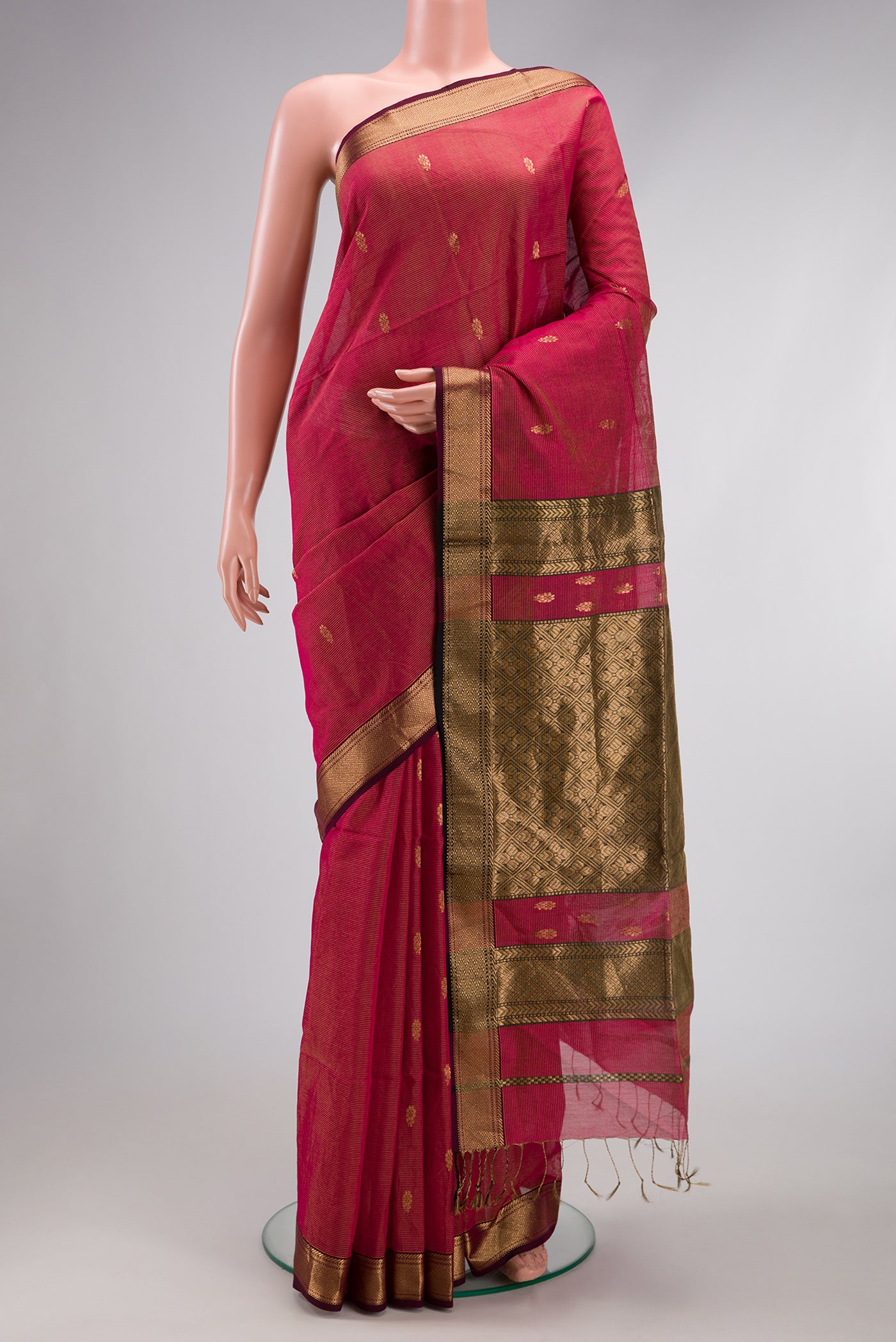Rani Pink Dual Tone Maheshwari Silk Saree with Stripes on the body and Zari Border.  displayed on a mannequin