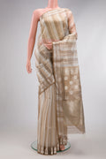 Dark Beige Dual Tone Maheshwari Silk Cotton Saree with Stripes on the body and Zari Border.  displayed on a mannequin