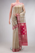 Dark Beige Dual Tone Maheshwari Silk Cotton Saree with Stripes on the body and Zari Border.  displayed on a mannequin