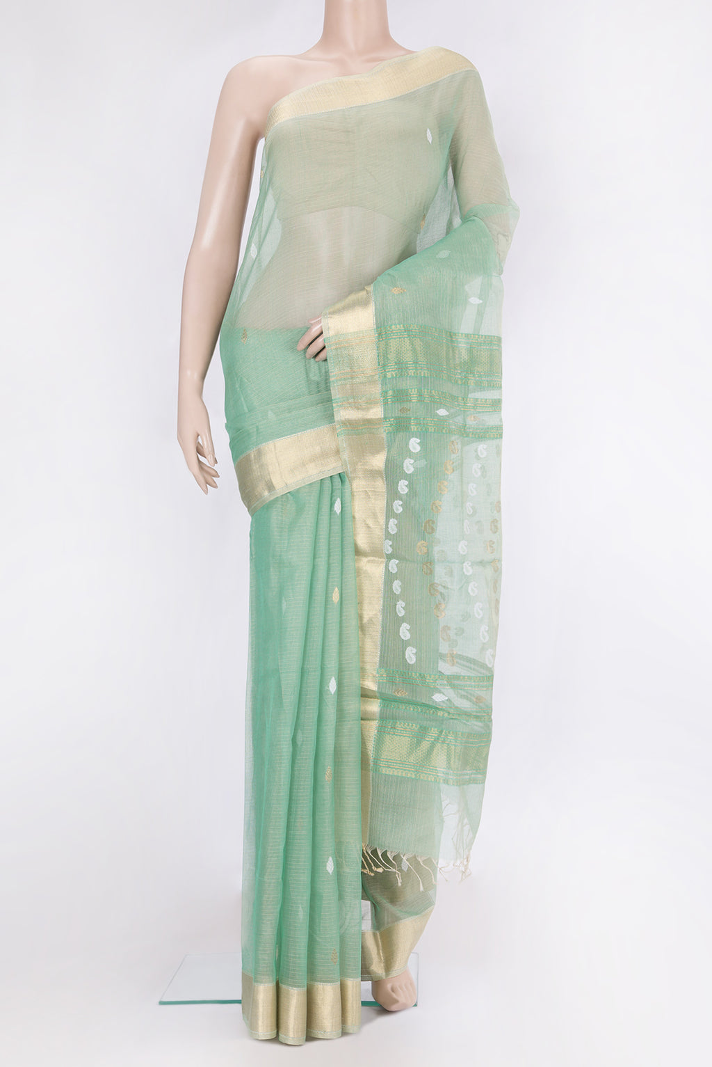 Pista Green Kota Silk Saree with Zari And Thread Butta on the body and Zari Border.  displayed on a mannequin