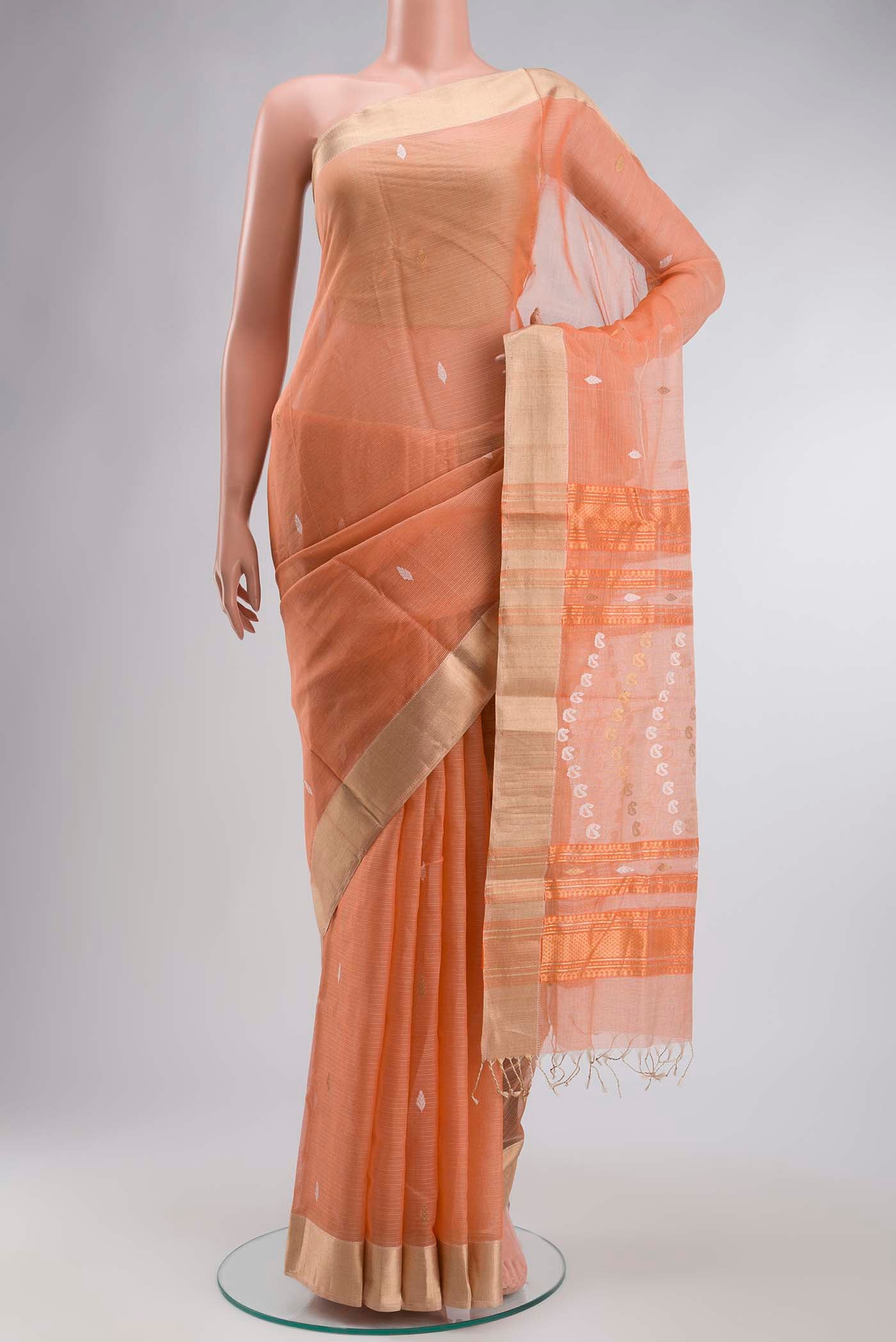 Orange Maheshwari Silk Cotton Saree with Zari Butta on the body and Zari Border displayed on a mannequin