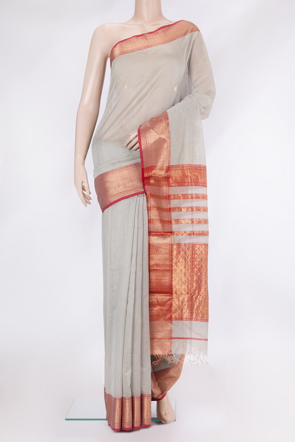 Beige Dual Tone Kota Silk Saree with Zari Butta on the body and Zari Border.  displayed on a mannequin
