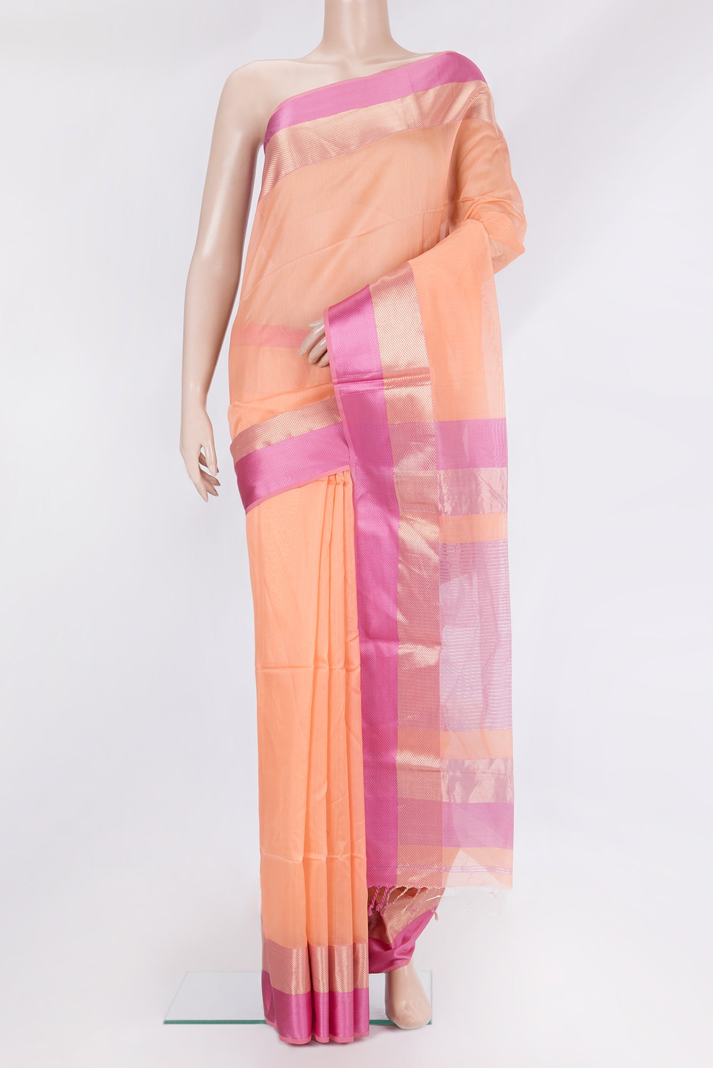 Peach Maheshwari Silk Saree with Plain Body and Zari And Thread Border.  displayed on a mannequin