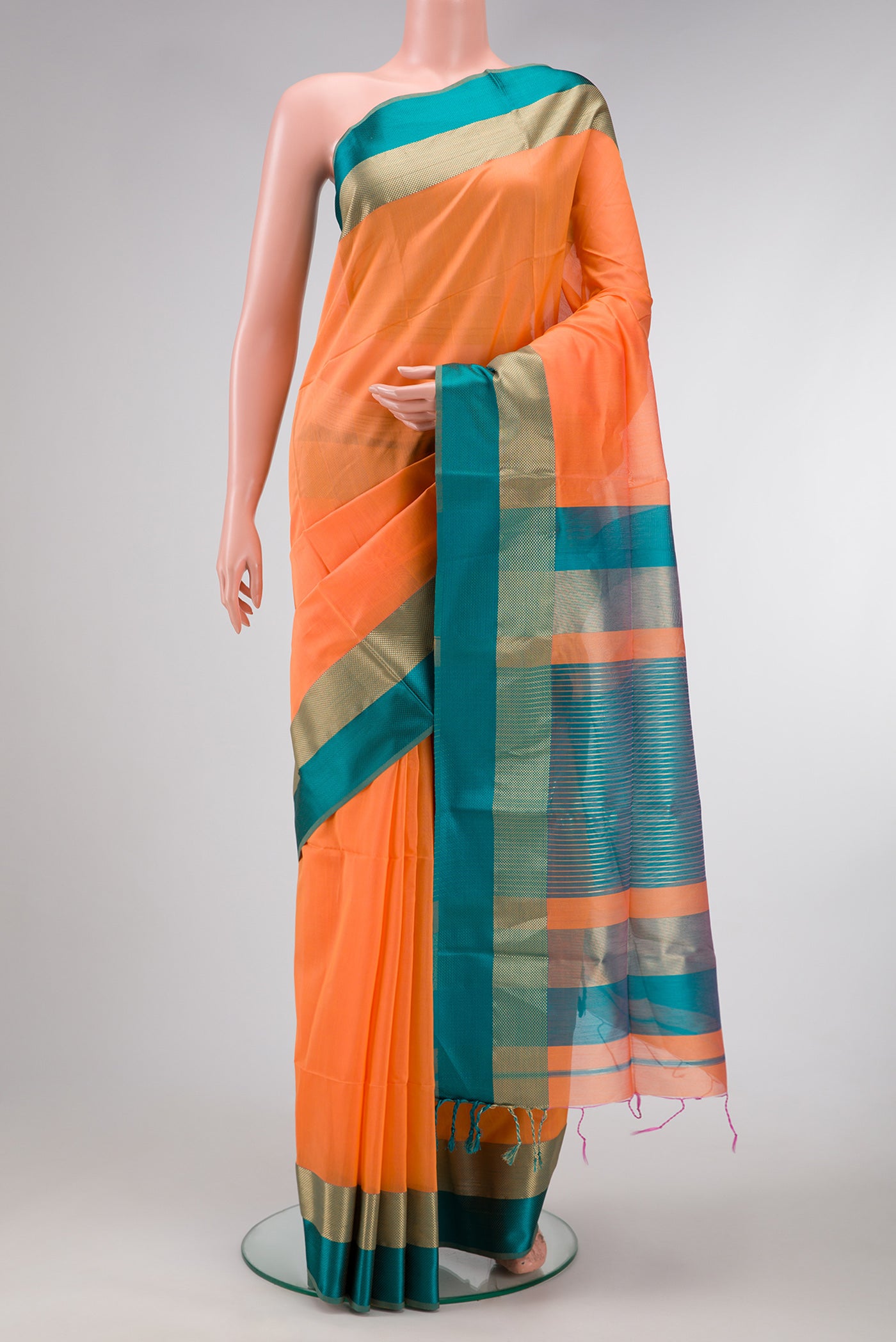 Orange Dual Tone Maheshwari Silk Saree with Plain Body and Zari And Thread Border.  displayed on a mannequin