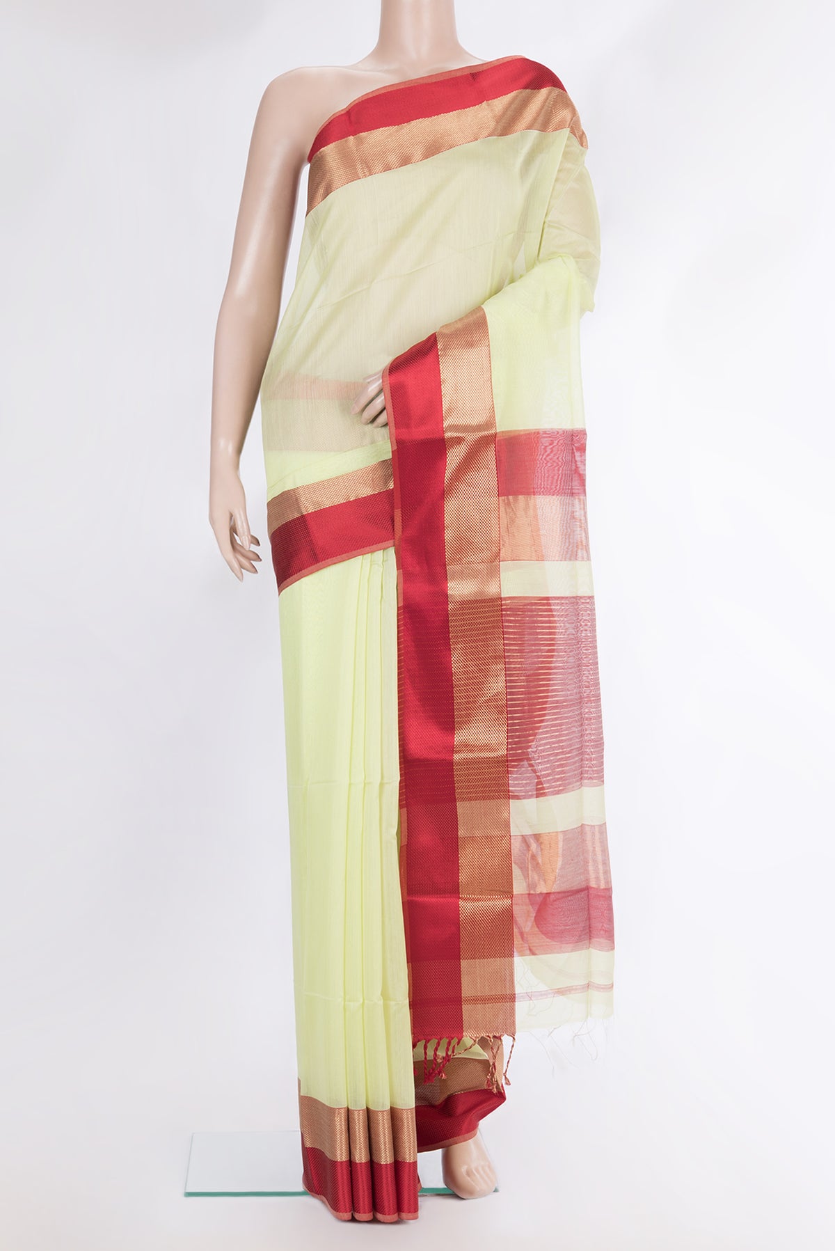 Pure Silk Pista Green Dual Tone Maheshwari Saree with Plain Body and Zari And Thread Border.  displayed on a mannequin